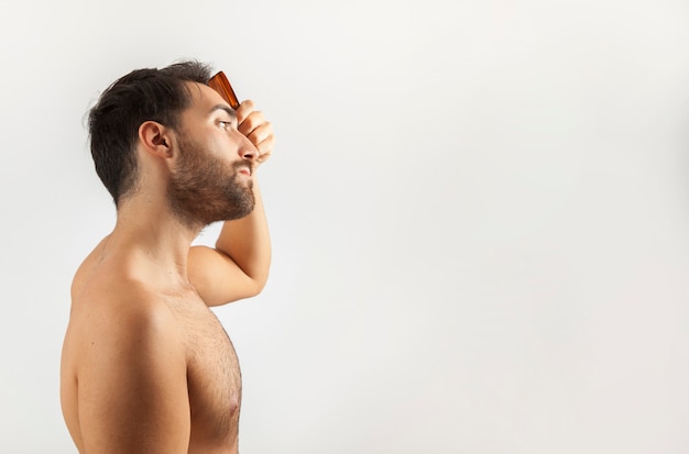 Man brushing his hair