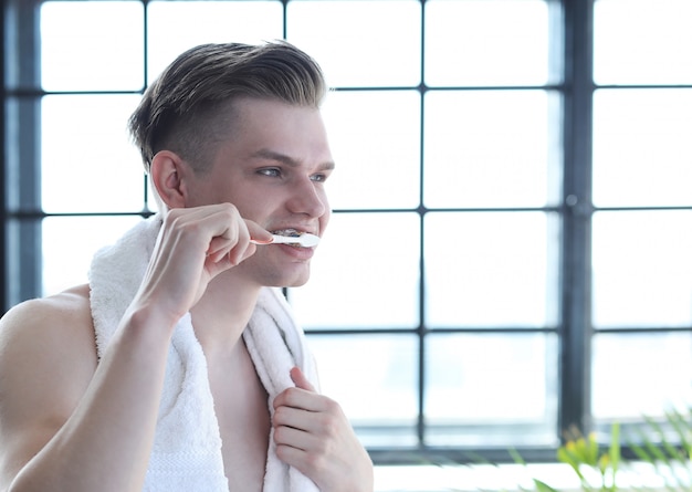 Man brushing teeth