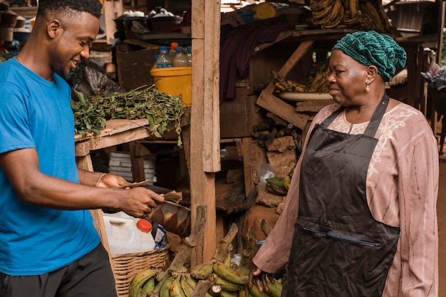 Man buying food from market