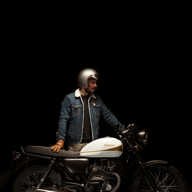 Man on cafe racer style motorbike