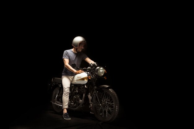 Free photo man on cafe racer style motorbike