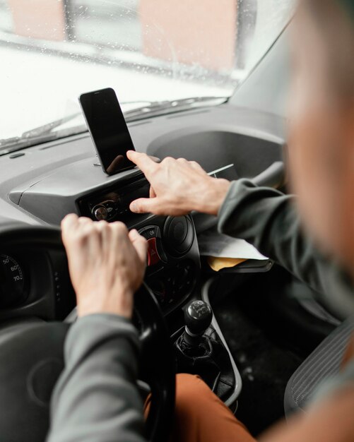 Man in car delivering package close up