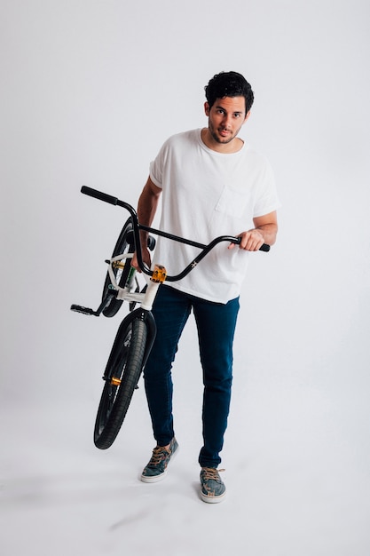 Man carrying bmx bike