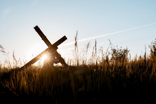 Free photo man carrying a cross