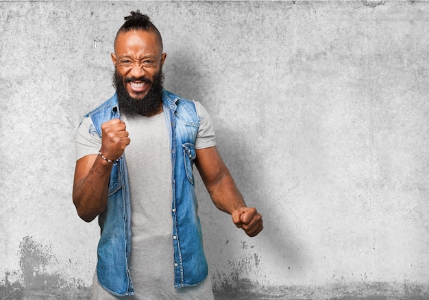 Man celebrating with a smile and a raised fist