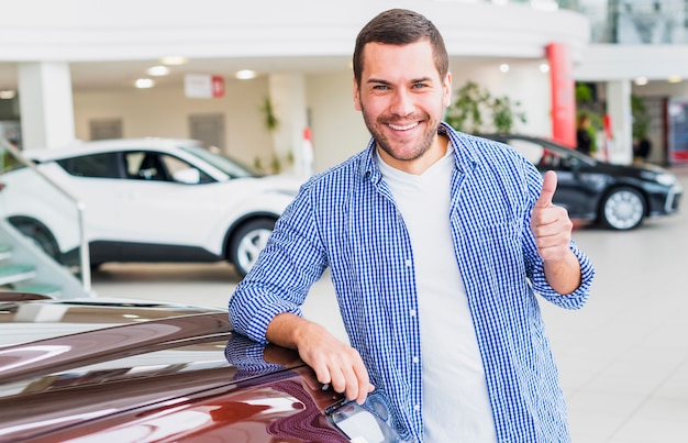 Man checking out new car