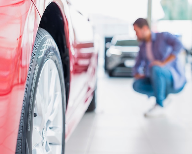 Man checking out new car