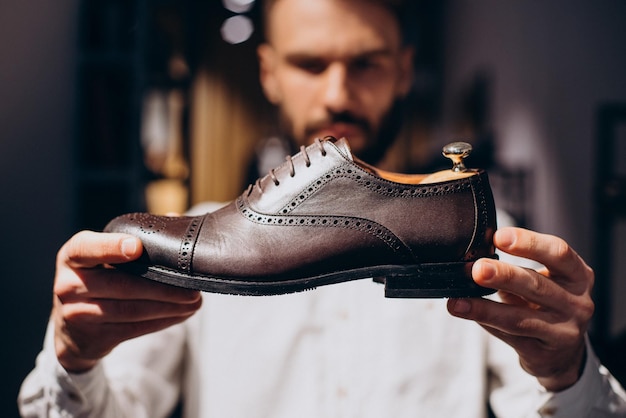 Man choosing foot wear at mens store