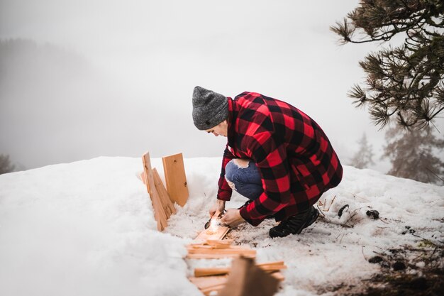 Man cleaning board from snow