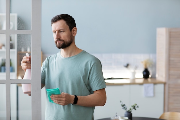 Man cleaning door