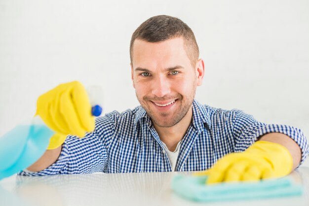 man cleaning his home