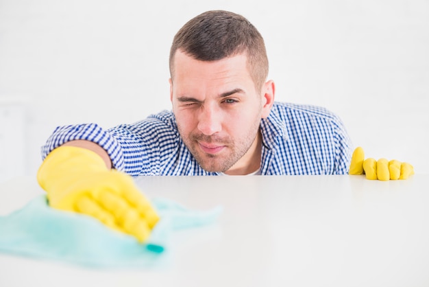 Man cleaning his home