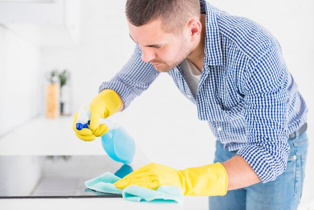 Man cleaning his home