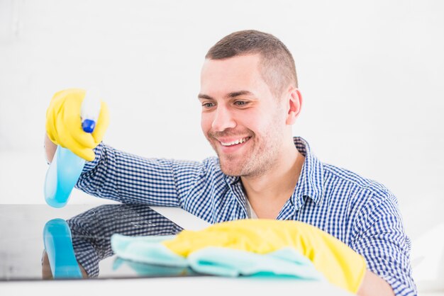 Man cleaning his home