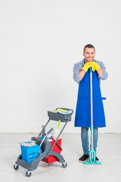 Free photo man cleaning his home