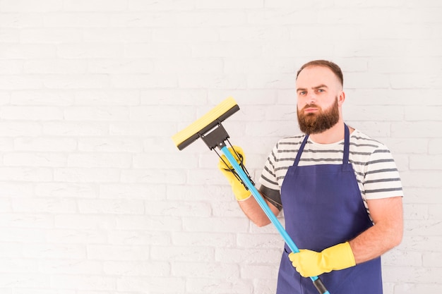 Free photo man cleaning his home