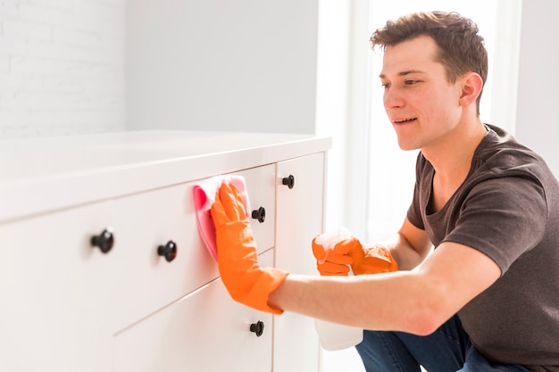 Man cleaning his home