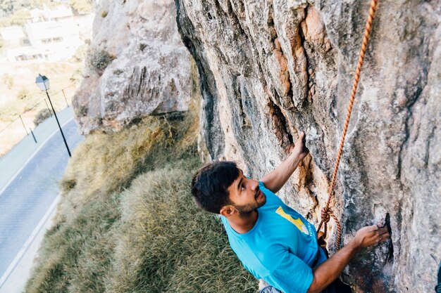 Man climbing with rope