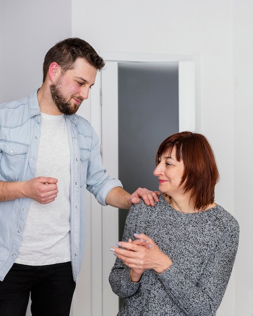 Free photo man comforting woman at therapy