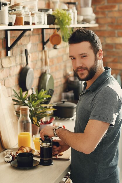 Man cooking in the kitchen. Breakfast morning