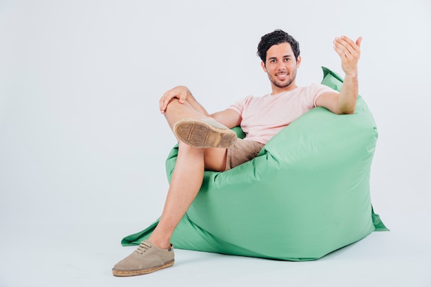 Man on couch doing come here gesture