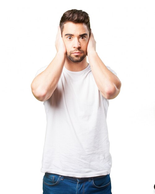 Man covering his ears with his hands