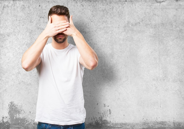 Man covering his eyes with his hand