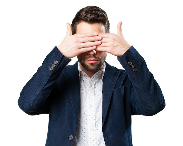 Man covering his eyes