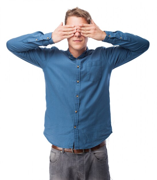 Man covering his eyes