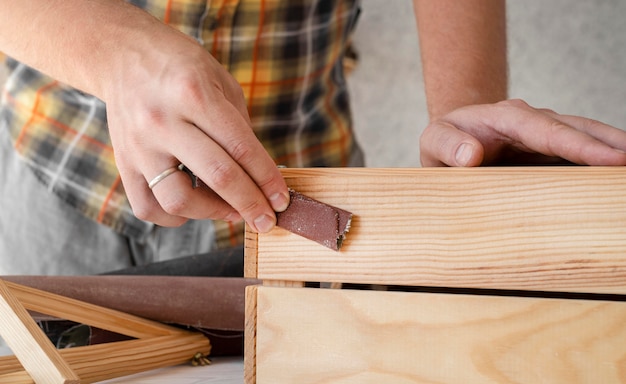 Free photo man crafting a wooden box