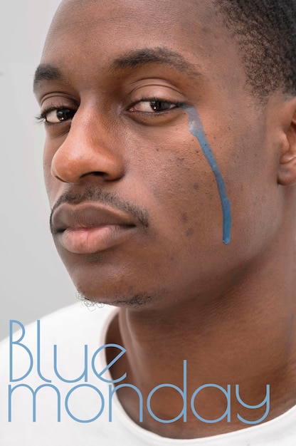 Free photo man crying with blue tears