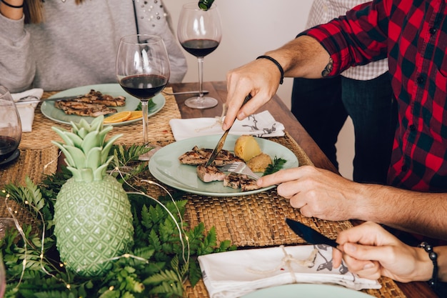 Man cutting steak