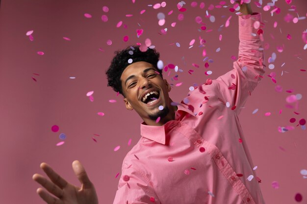 Man dancing with confetti medium shot