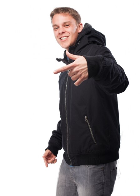 Man in a dark sweatshirt making a hand gesture