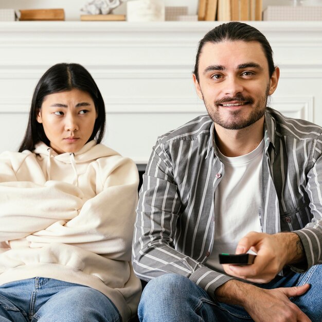 Man deciding what movie to watch front view