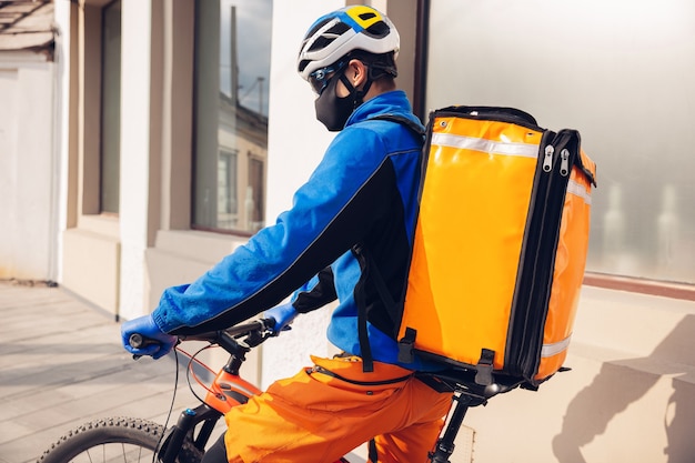 Man delivers food and shopping bags during isolation