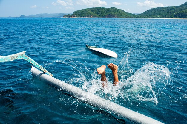 Man dive into the water.