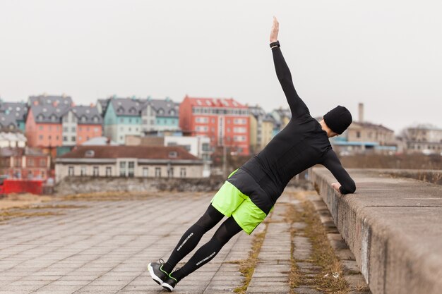 Man doing exercises in city