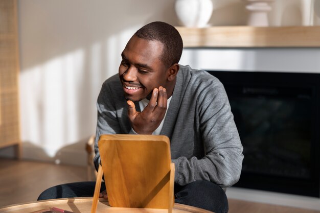 Man doing makeup indoors