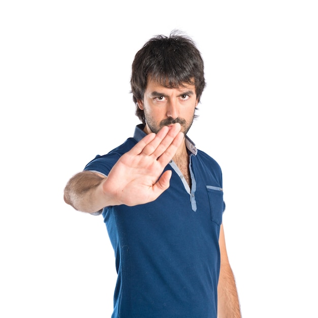 Man doing NO gesture over white background