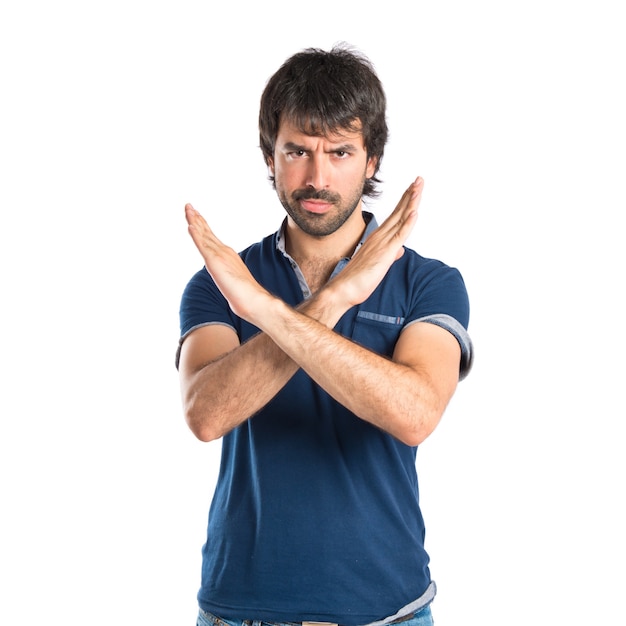 Man doing NO gesture over white background