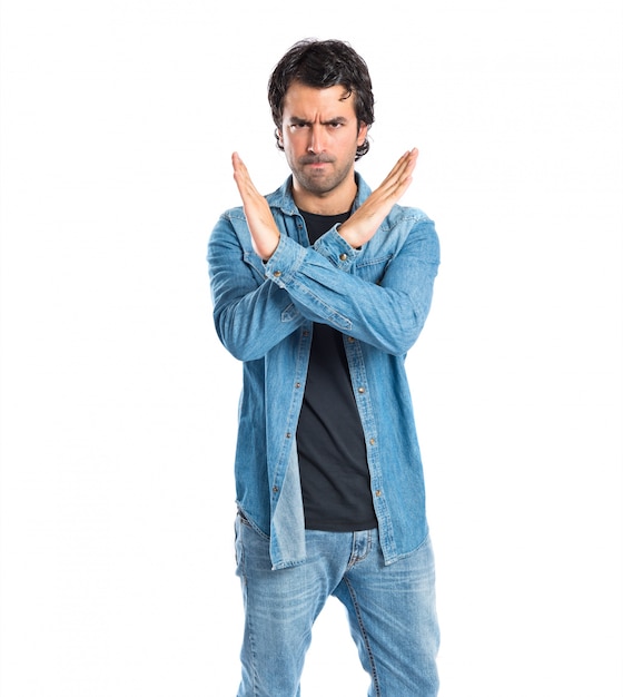 Man doing NO gesture over white background