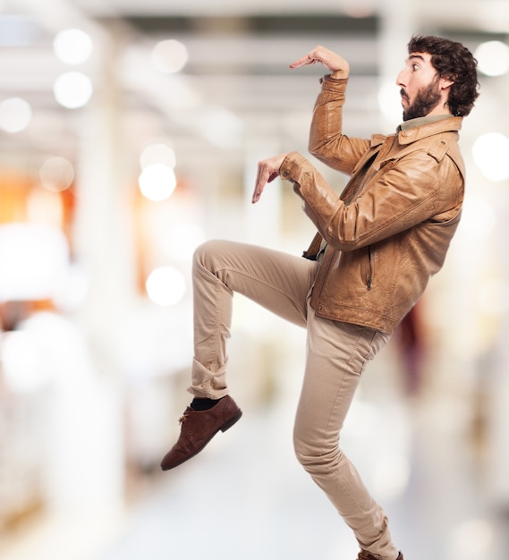 Free photo man doing the praying mantis posture