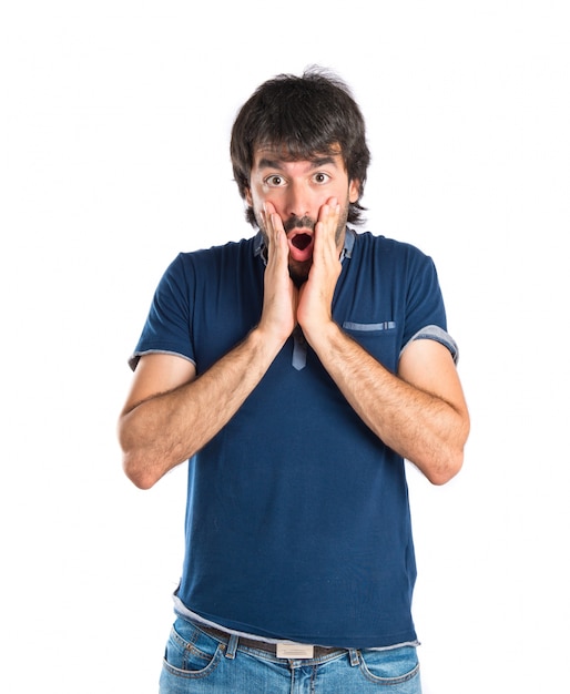 Man doing surprise gesture over white background