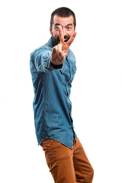 Man doing victory gesture