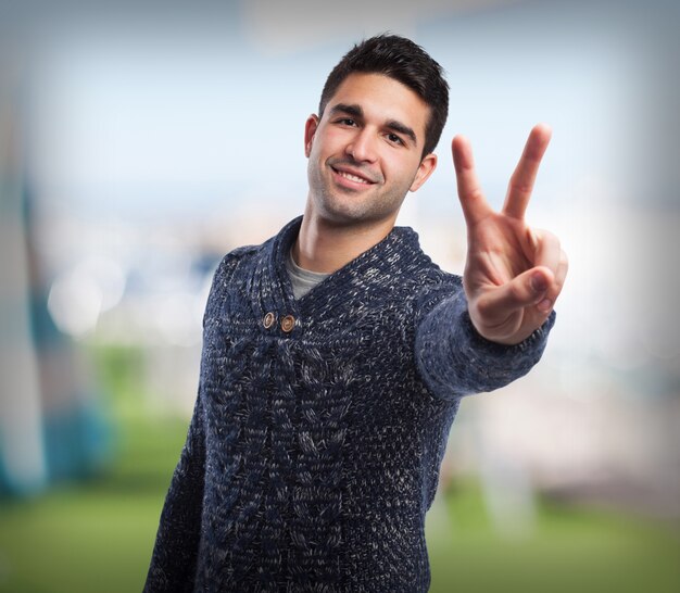 man doing a victory sign