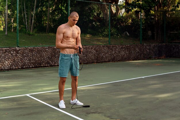 A man doing with rubber bands. bali