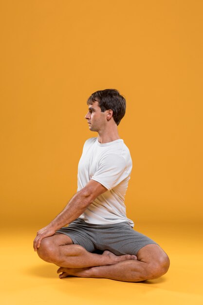 Man doing yoga exercise