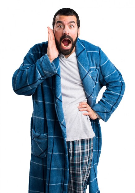 Man in dressing gown doing surprise gesture