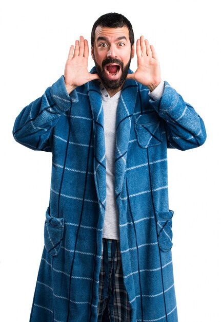 Man in dressing gown doing surprise gesture
